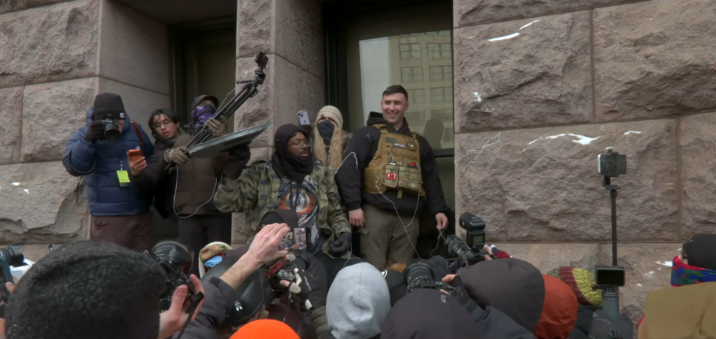 Jake Lang Chased Out of Minneapolis Rally Amid Protest Chaos Jake Lang Chased Out of Minneapolis Rally Amid Protest Chaos